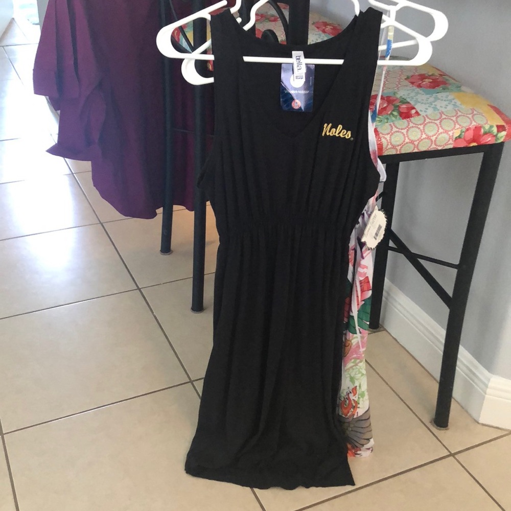 Black cotton dress with “Noles” embroidered